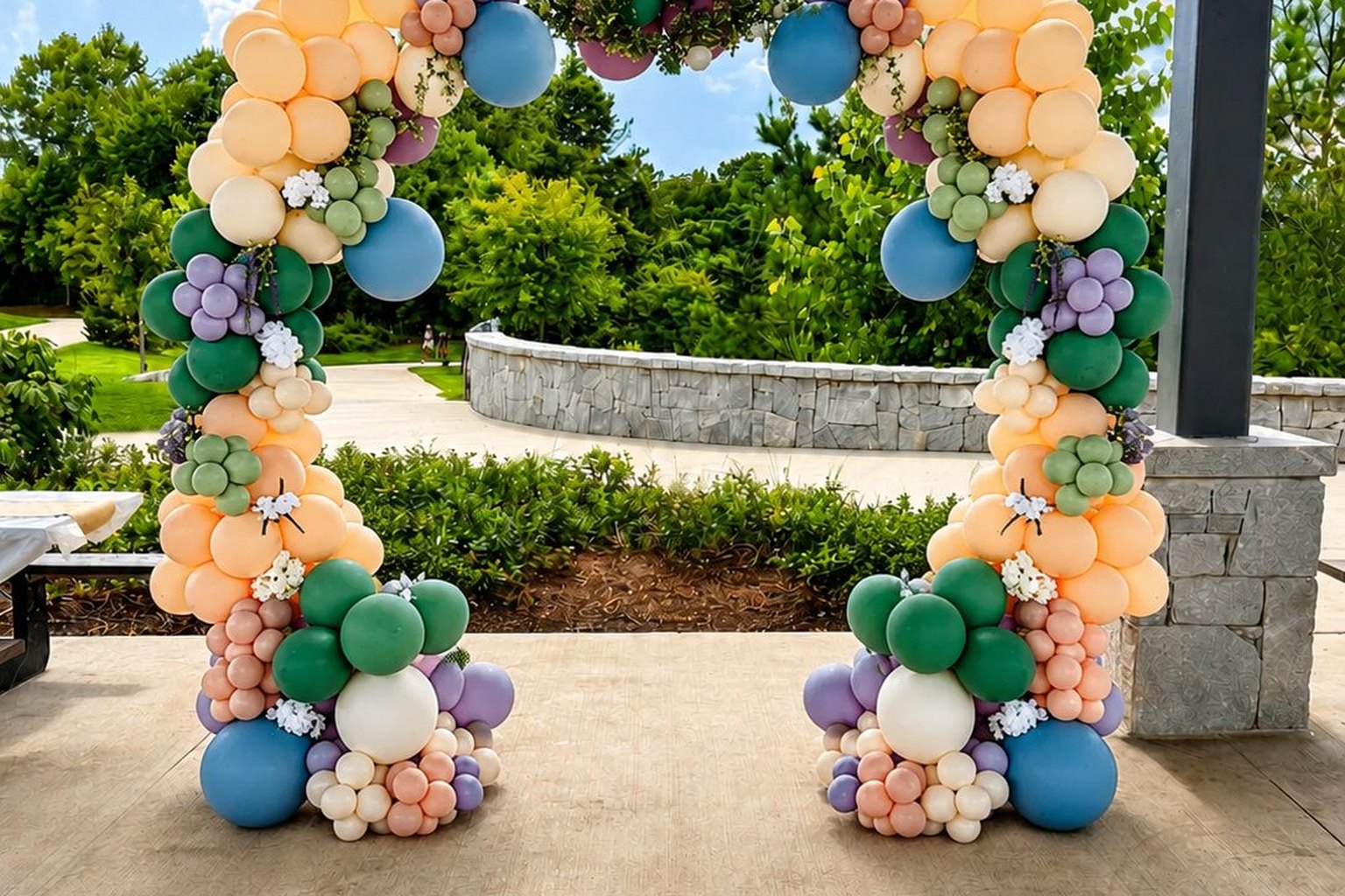 White, gold and green balloon garland over a styled table