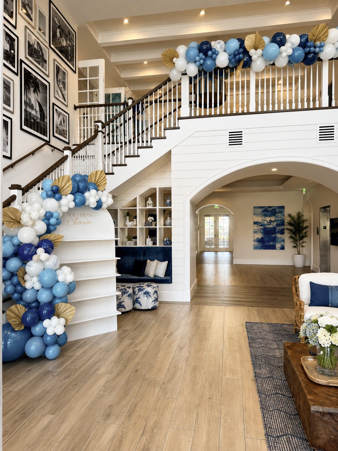 Balloon garland installed across a staircase entry