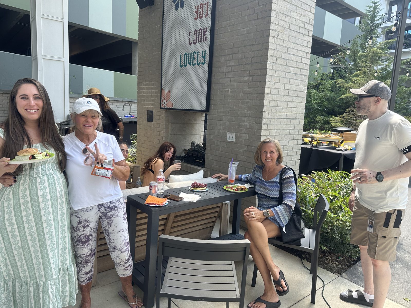 Residents gathered at a daytime courtyard event