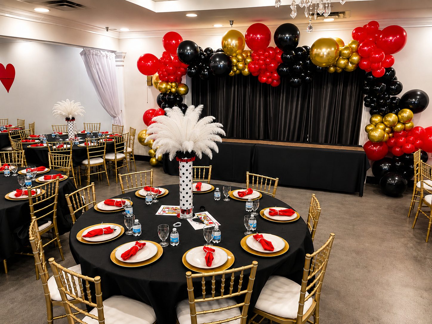 Full event room styled with themed tables and balloons
