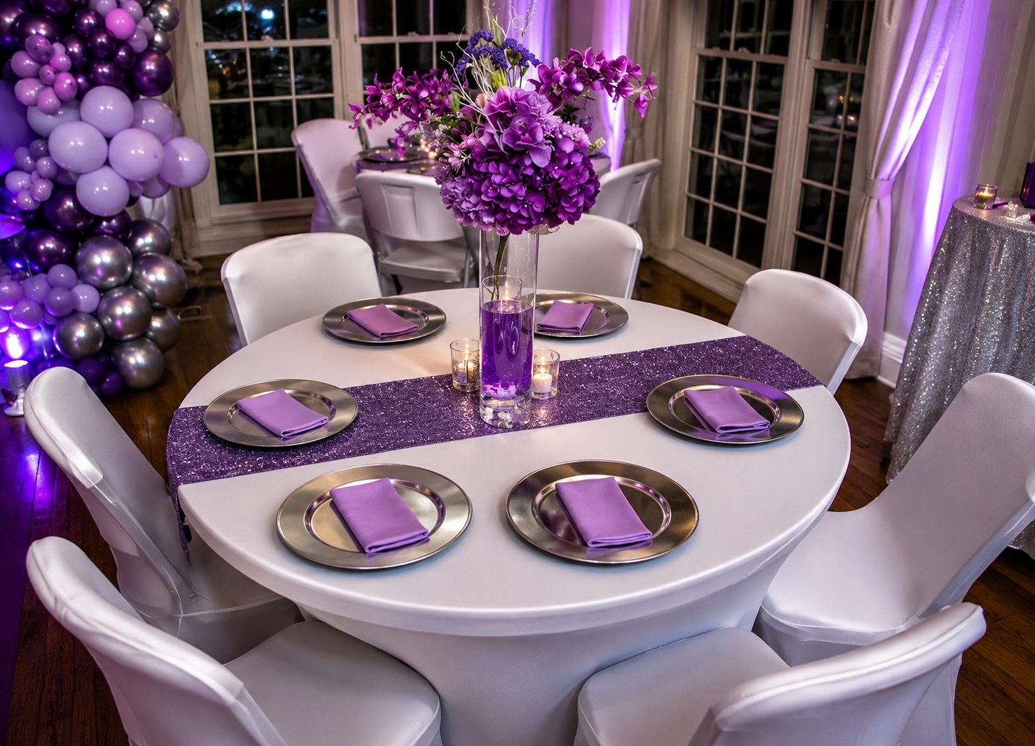 Purple and silver tablescape with floral centrepieces