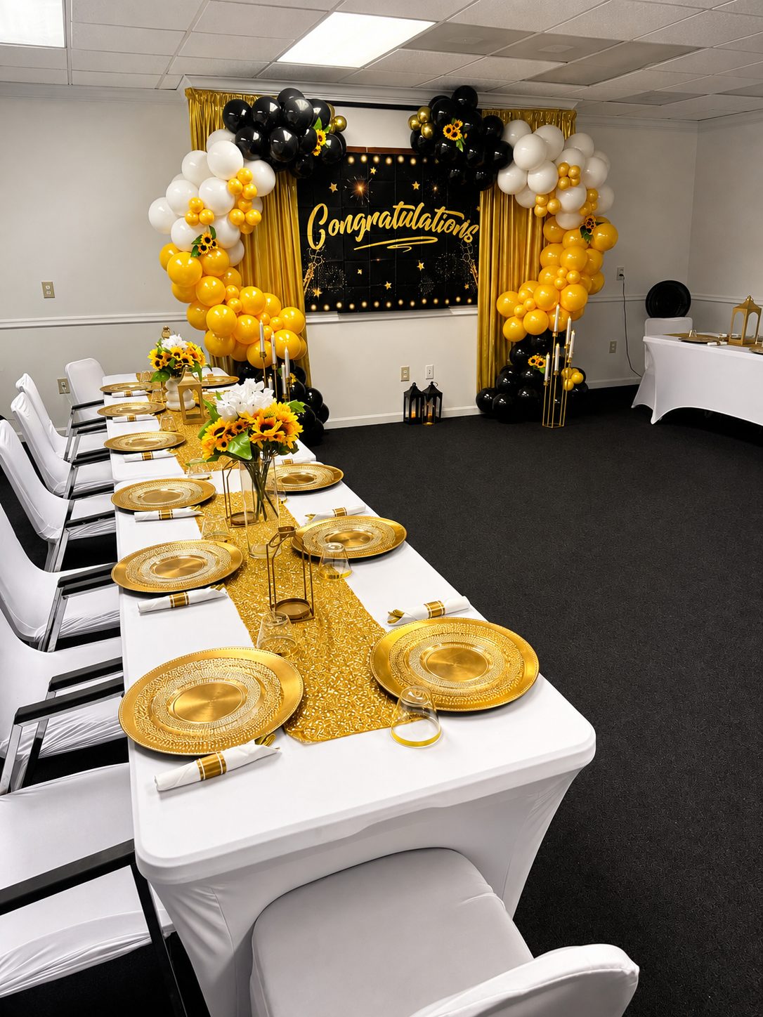 Black and gold ballroom styled for a celebration