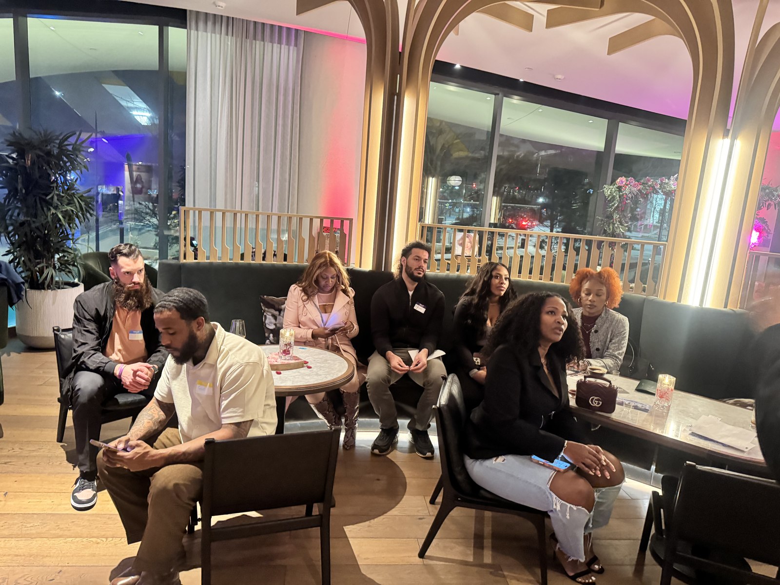 Attendees seated in conversation at a mixer