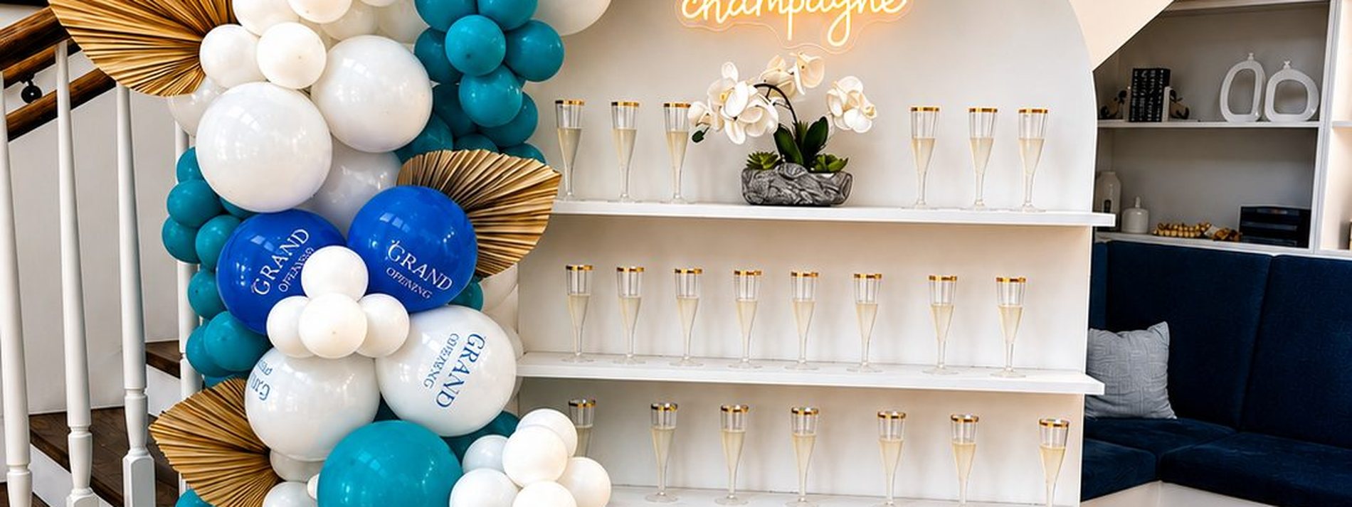 Branded lounge and floral backdrop
